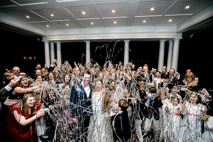 Wedding celebration with guests and streamers.